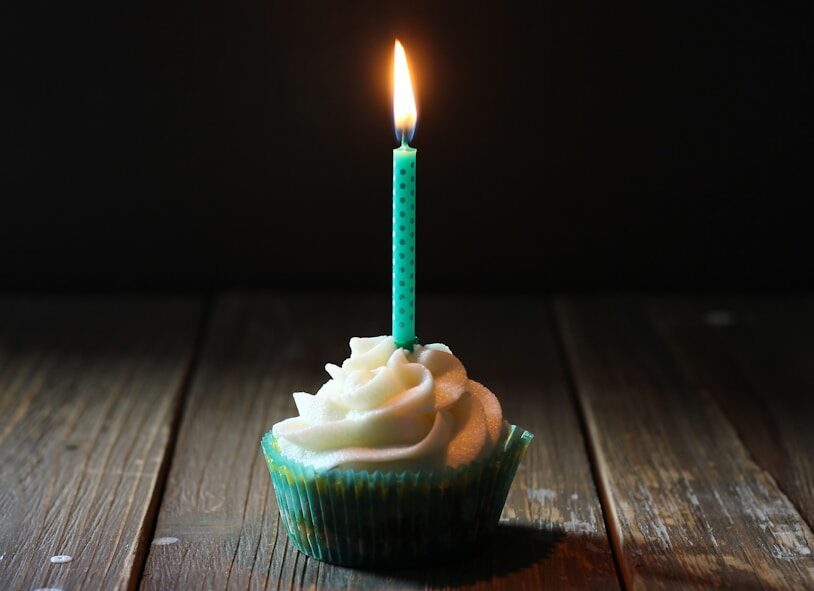 taper candle on cupcake